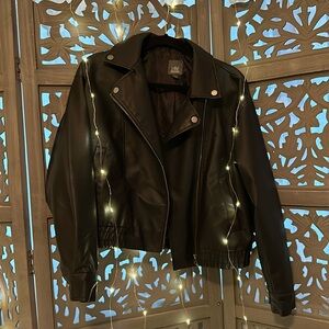 Black faux leather, zip up jacket.